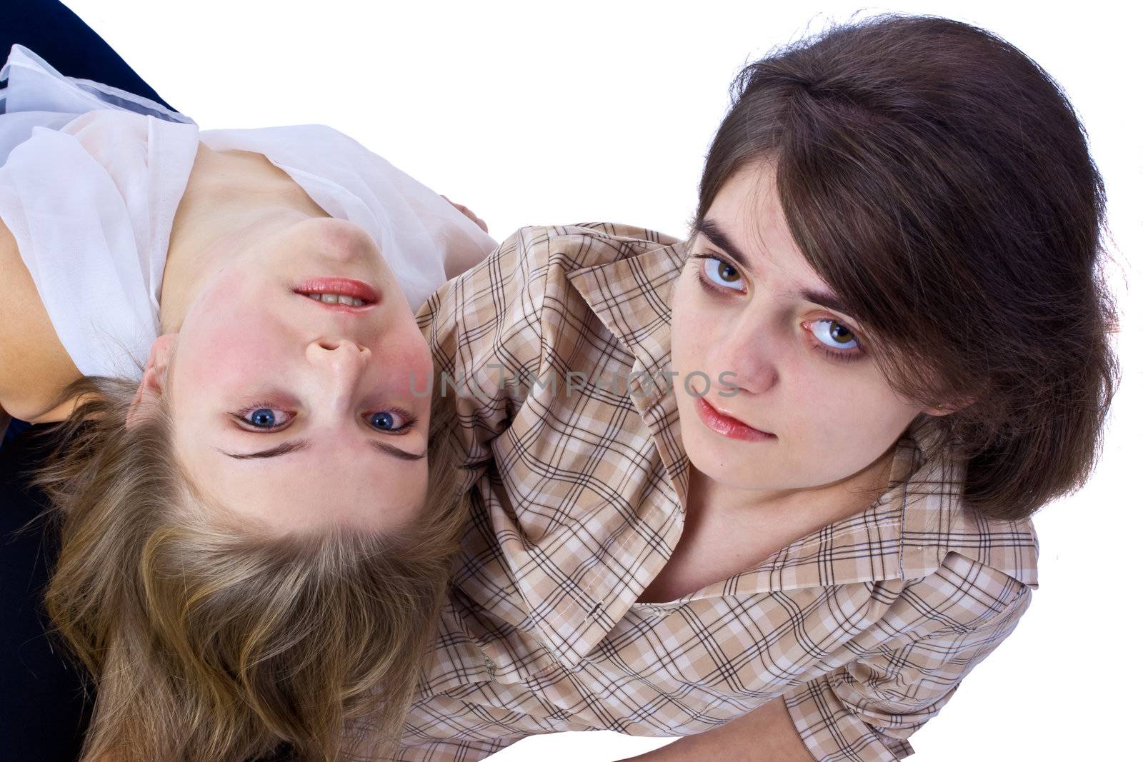 two young females relaxing isolated on the white