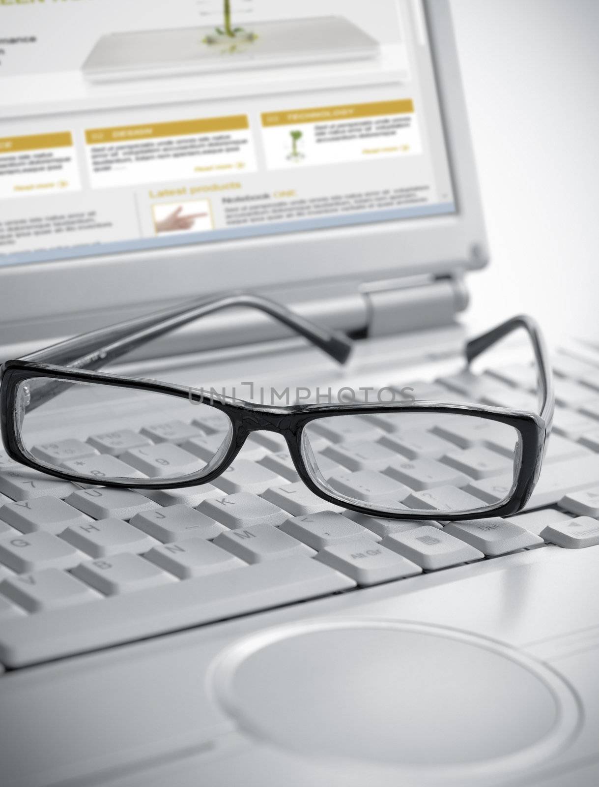 Pair of glasses sitting on laptop keyboard-Note:All elements from this collage are created by me