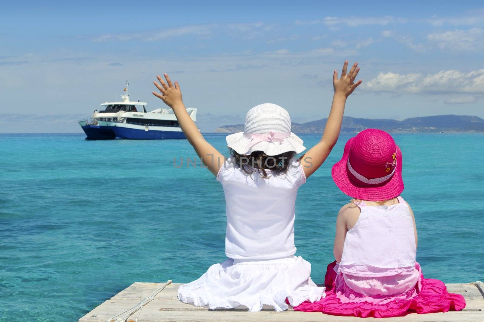 two girls tourist turquoise sea back goodbye boat hand gesture Formentera