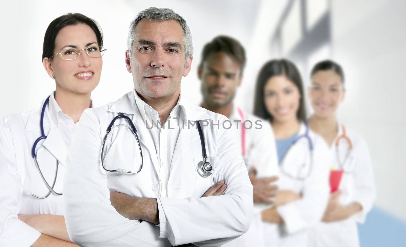 expertise gray hair doctor multiracial nurse team row over white