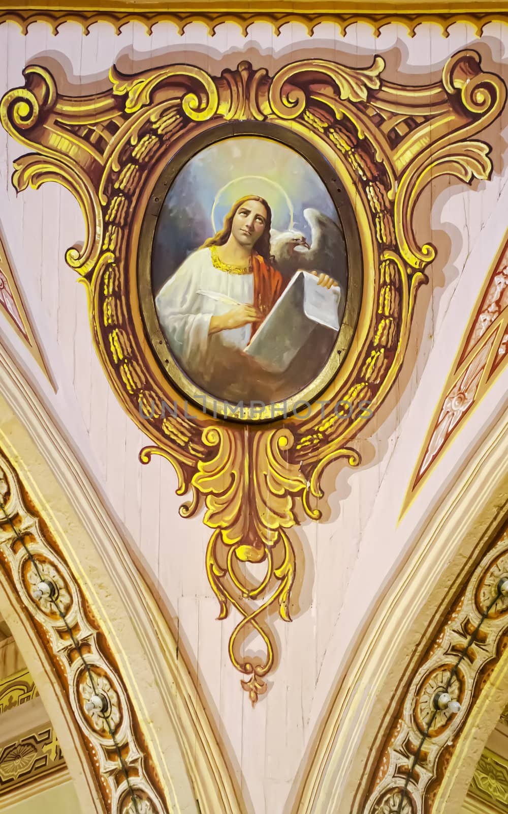 St. John, the Gospel writer, is depicted in a 400-year old painting in the church of Betis, Pampanga.  A church dubbed as the Sistine Chapel of the Philippines because of its intricate ceiling painting.