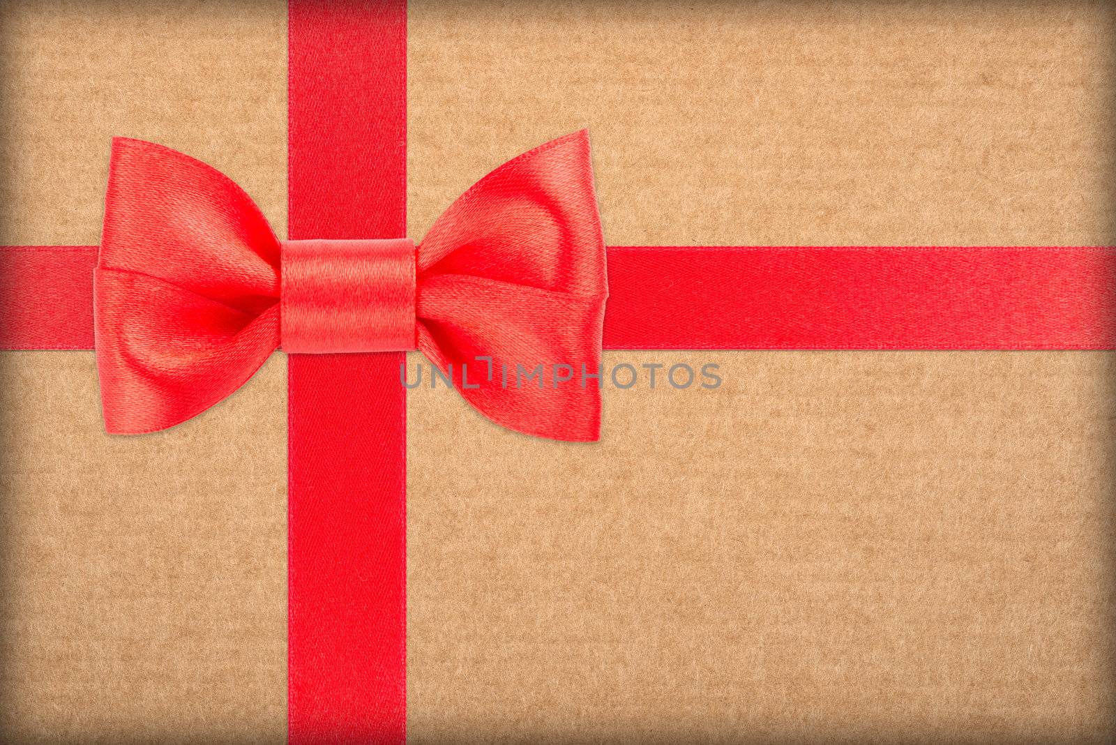 red bow and ribbon over wrapped gift