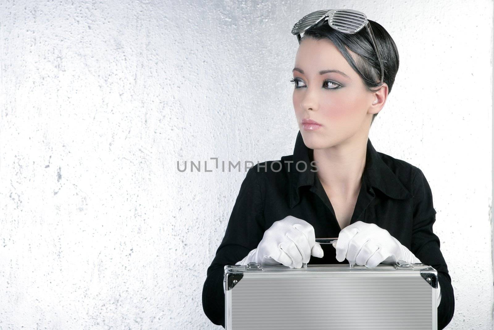 futuristic businesswoman holding silver briefcase fashion short hair brunette