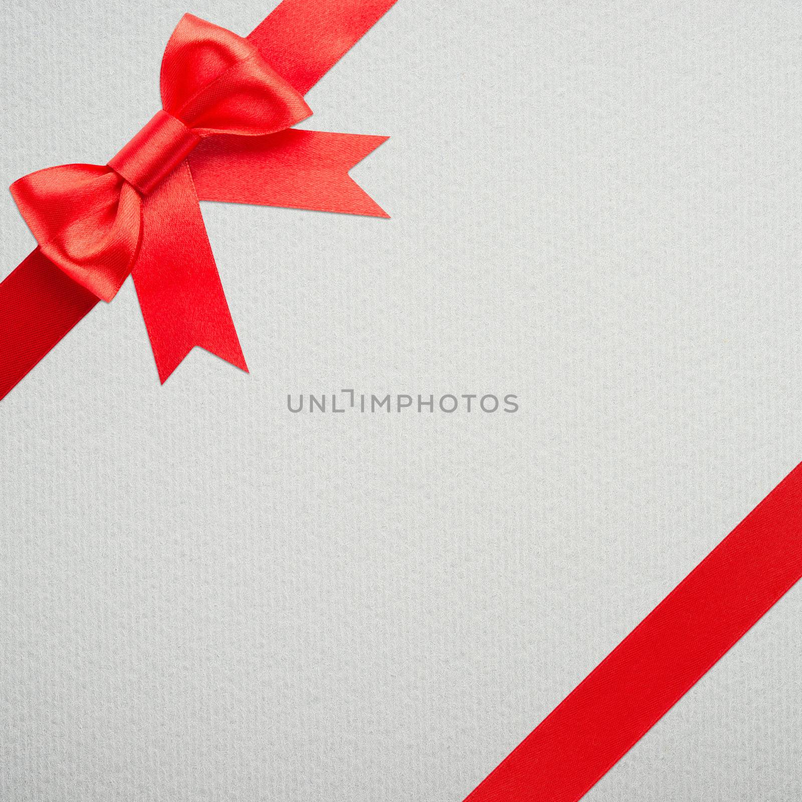 red bow and ribbon over wrapped gift