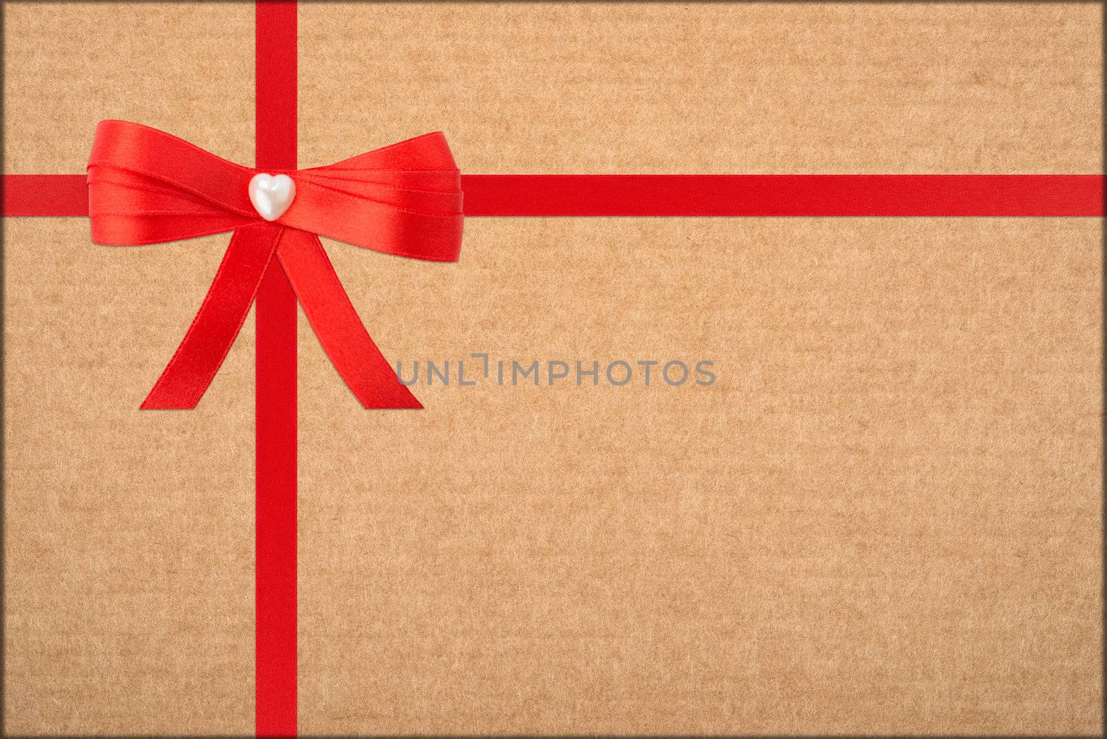 red bow and ribbon over wrapped gift