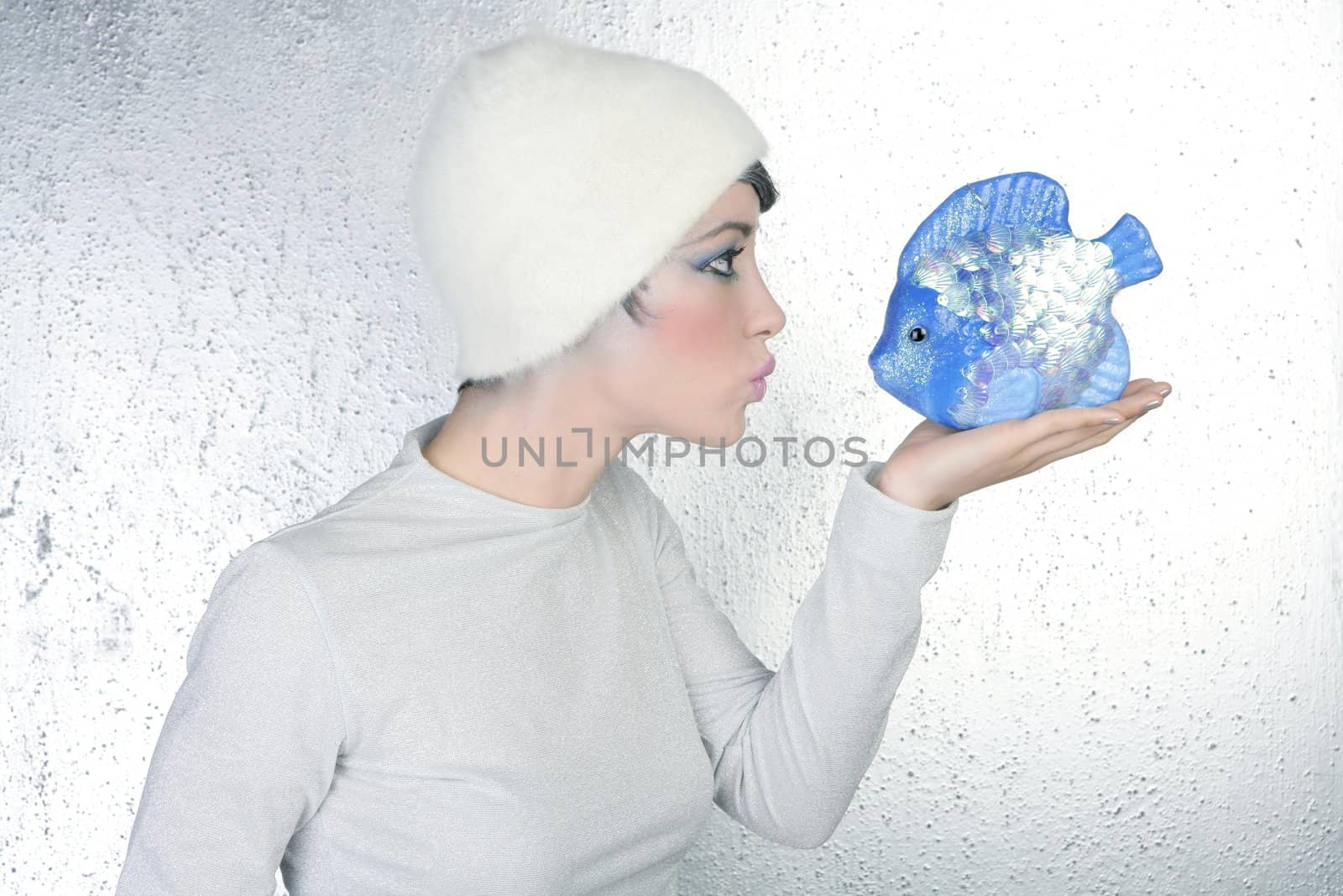 woman profile holding fish kissing expression by lunamarina