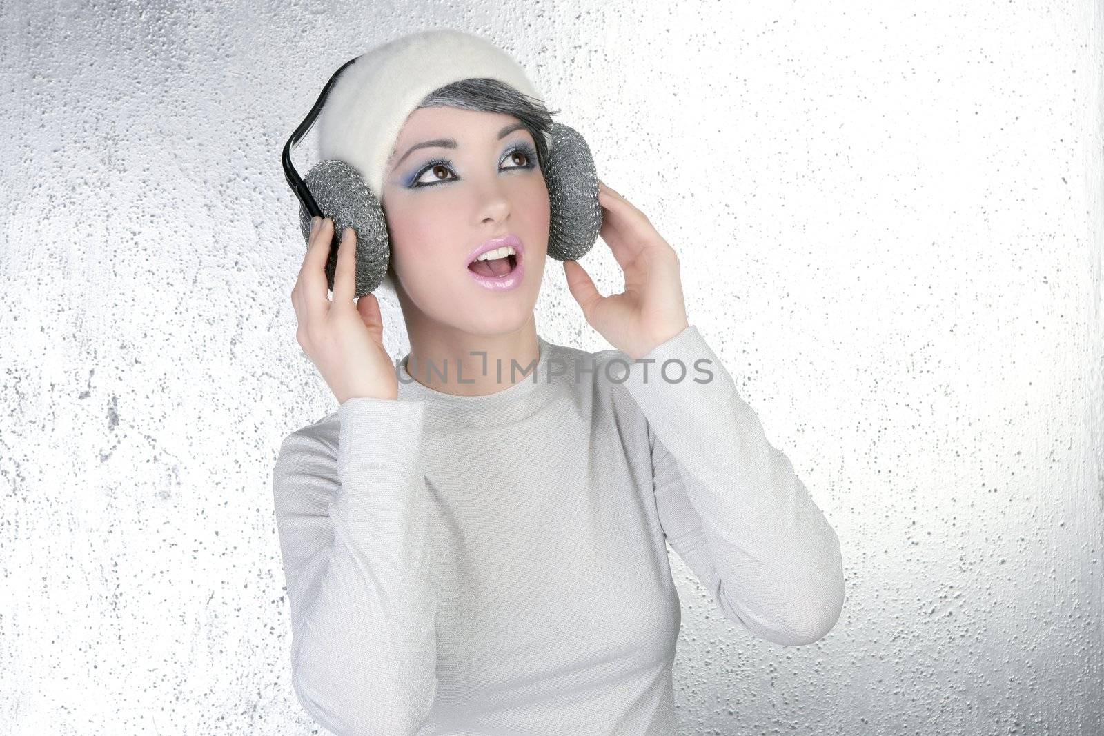 futuristic fashion future woman hearing music silver headphones