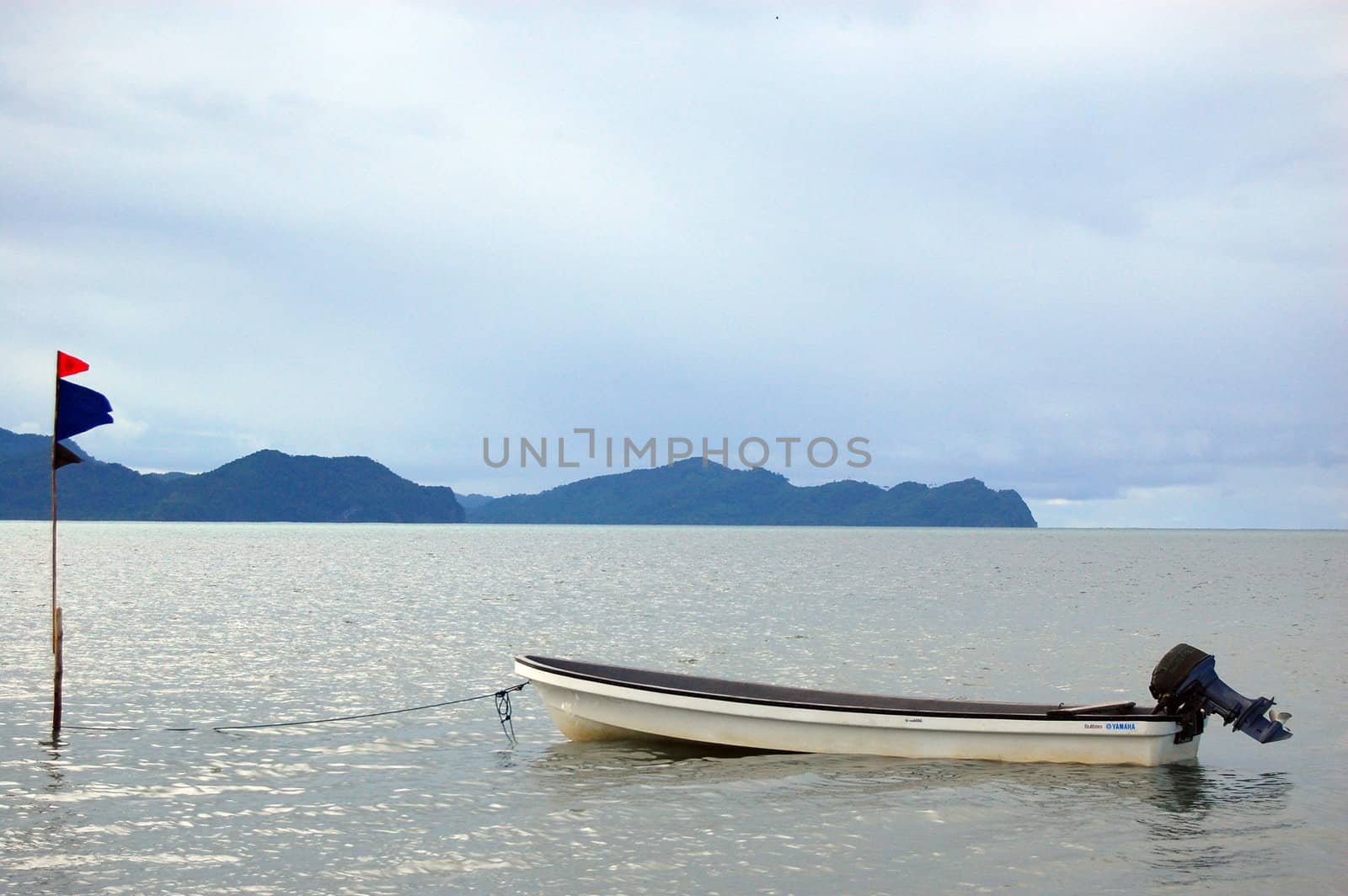 Laid up speedboat and flag, Papua New Guinea