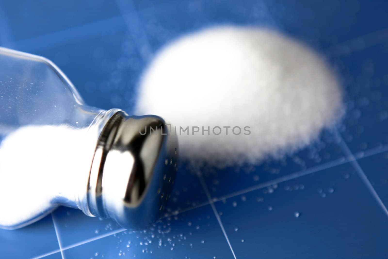 Salt shaker on wooden table