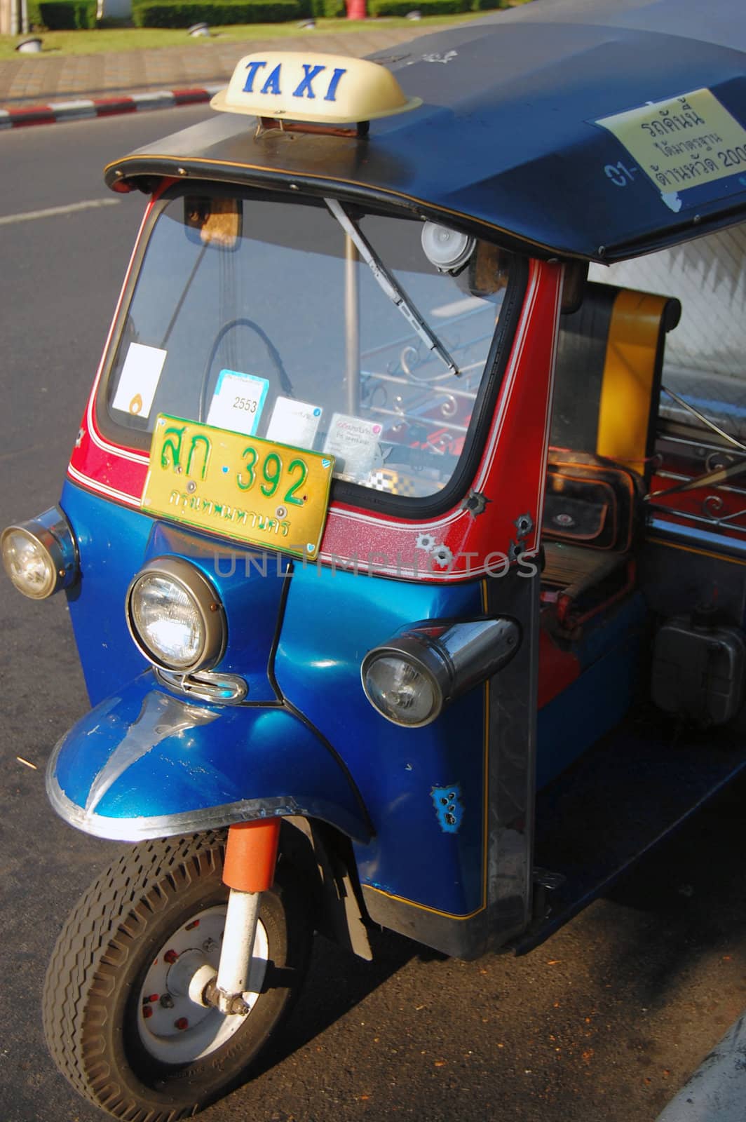 Tuk-tuk taxi vehicle, urban Thailand