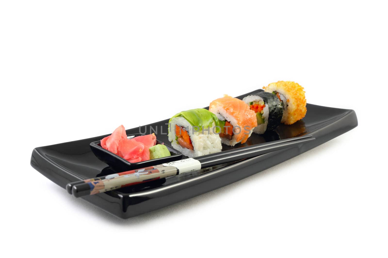 Sushi and wasabi sauce in black plate on the white background