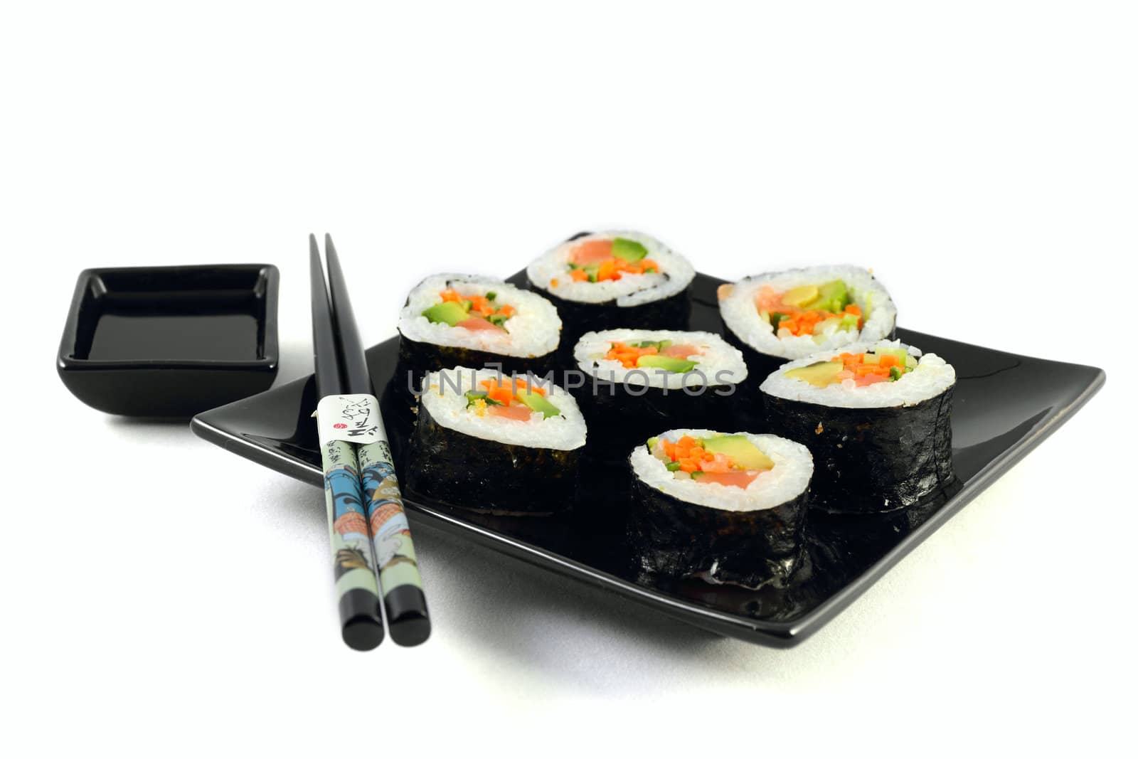 Sushi on black plate on the white background