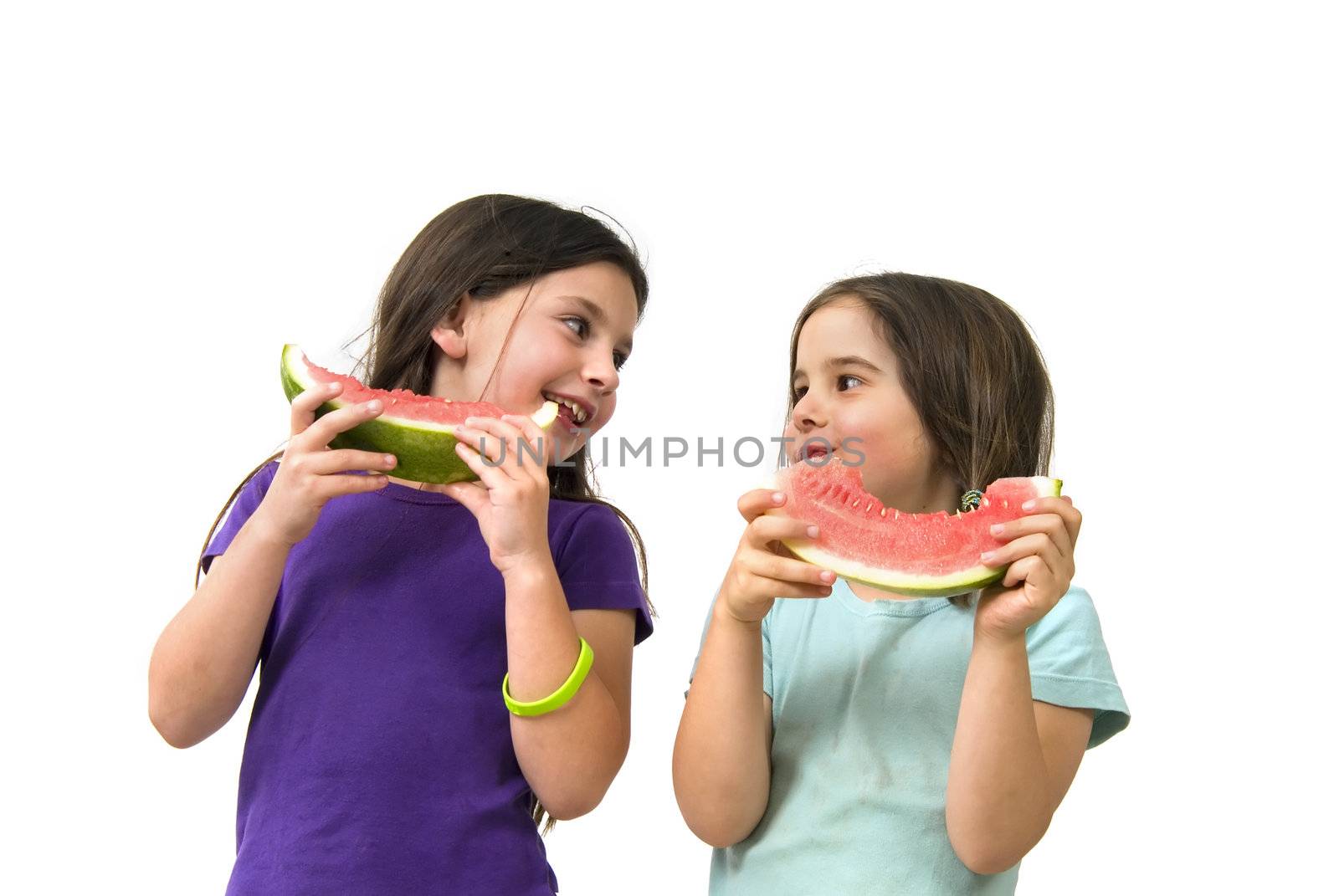 Two girls eating Watermelon isolated on white background