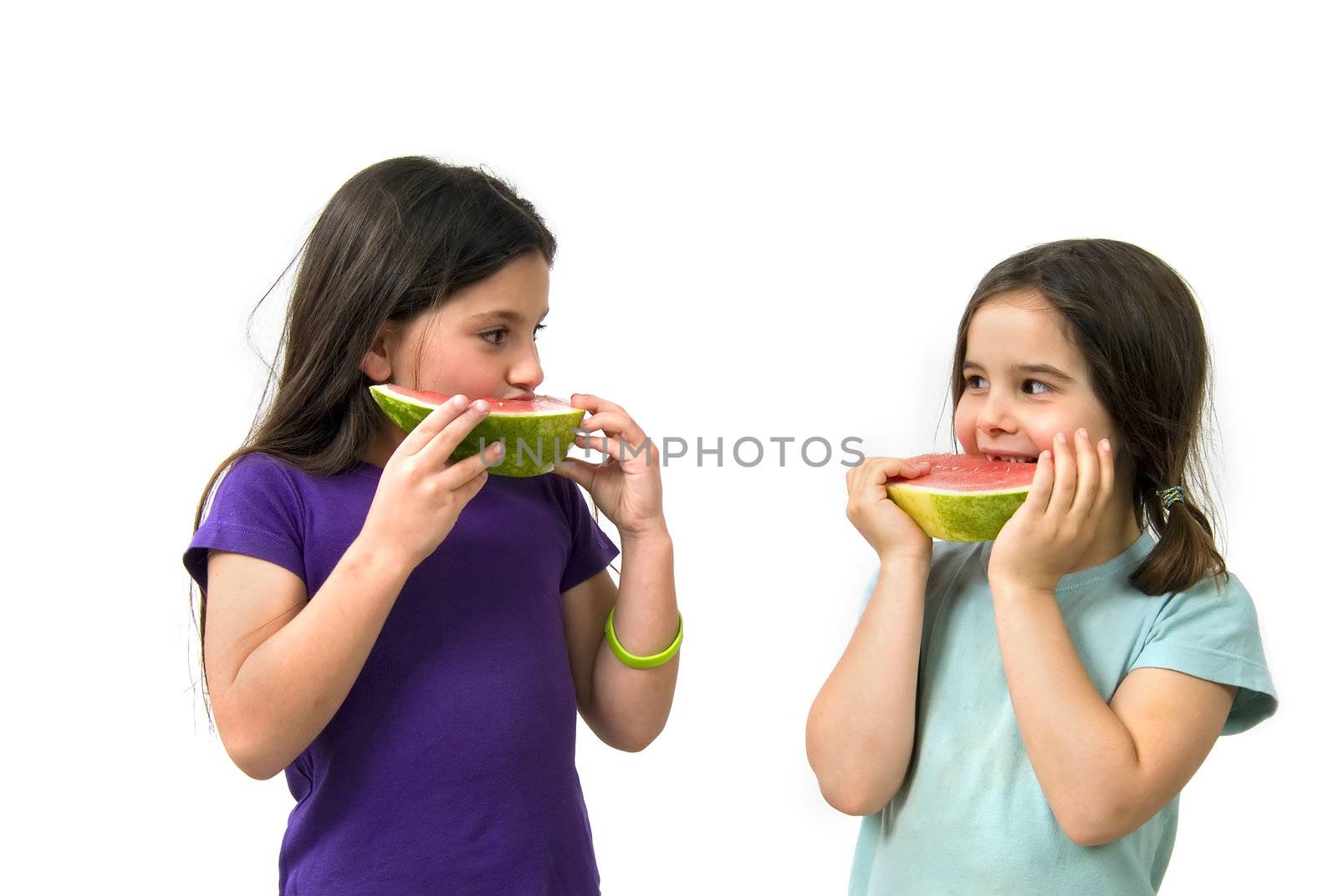 Two girls eating Watermelon isolated on white background