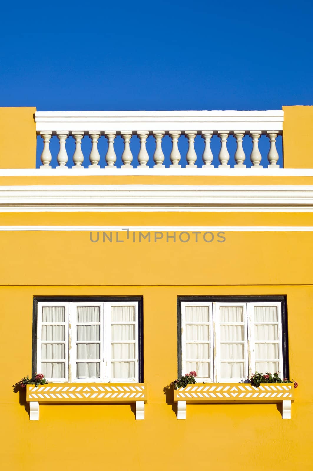 Bright yellow building with square windows