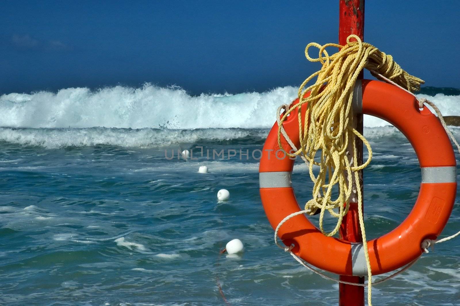 Beach life saver with rough sea and big waves in the background