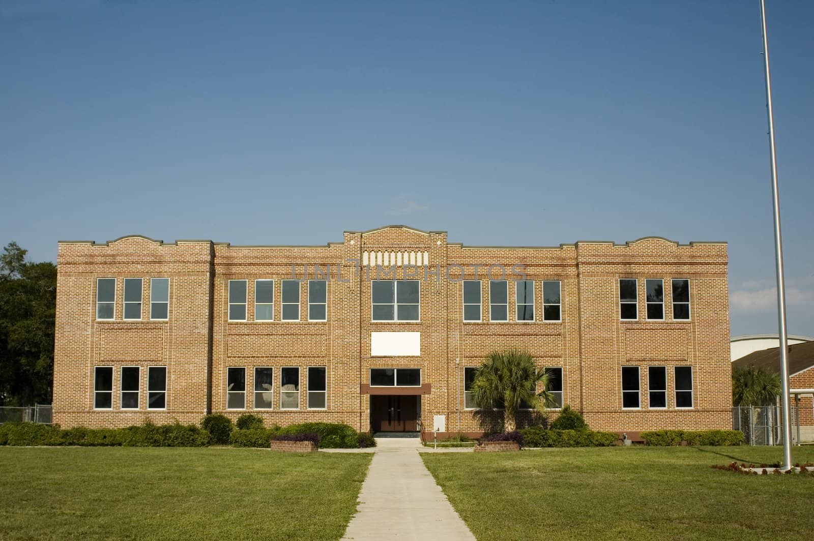 An old school building from a straight-on vantage point.