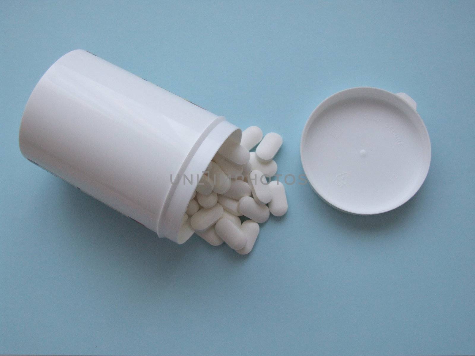 pills pouring from container