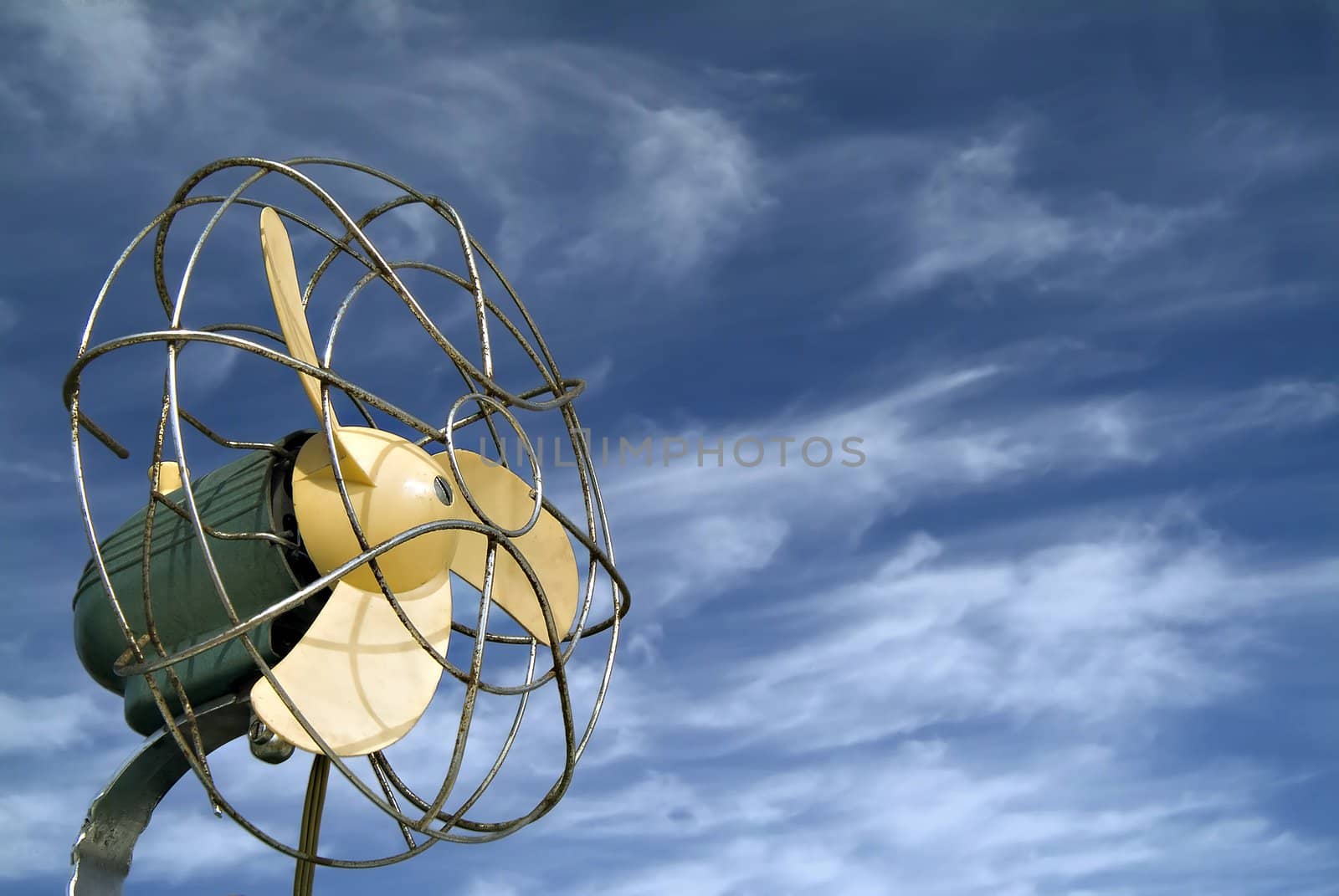 retro ventilator agaist blue sky with cirrus clouds
