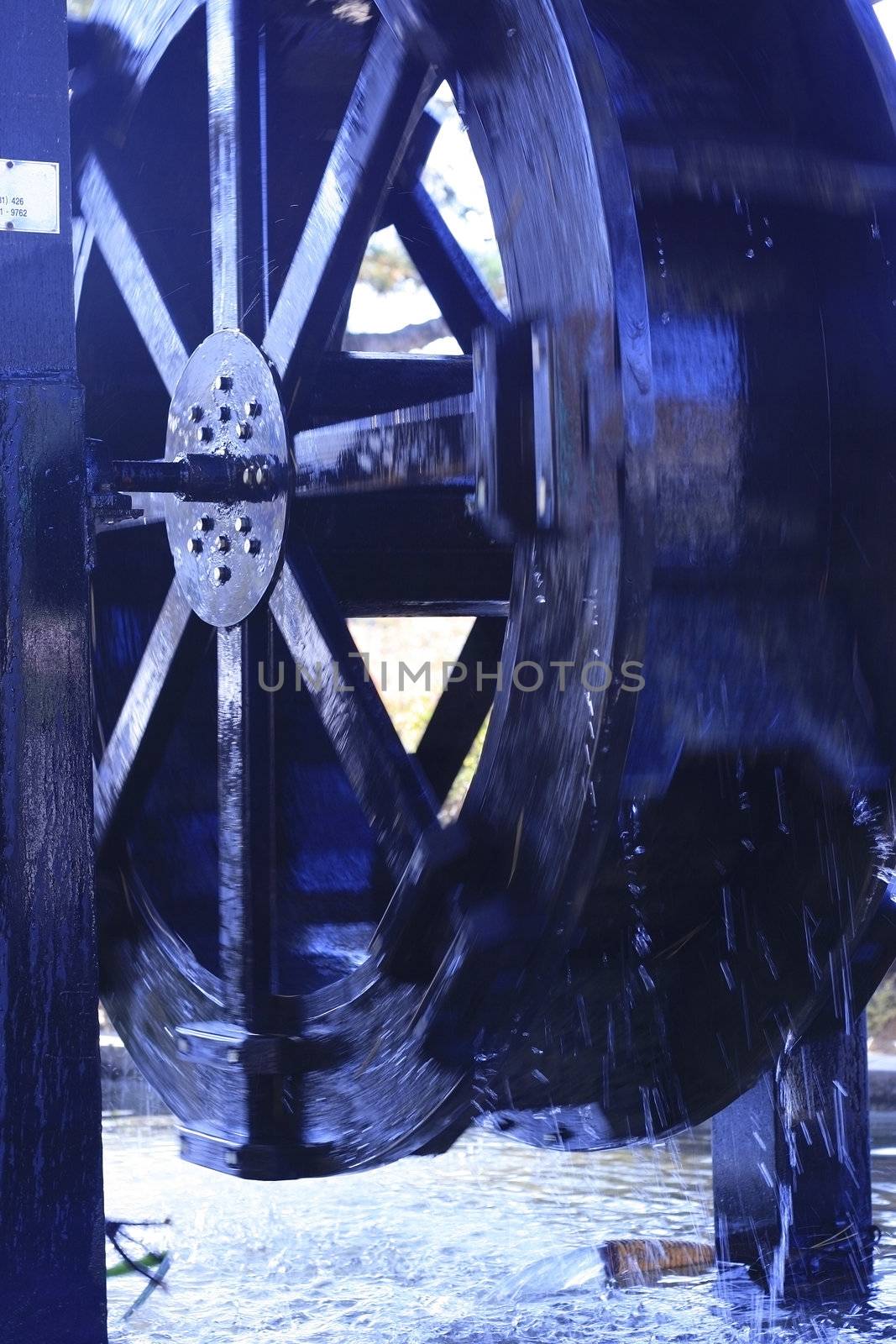 Antique Waterwheels working - with water in motion blur