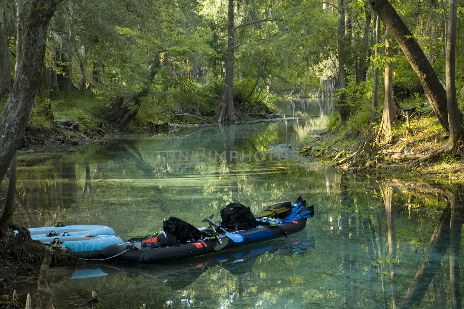A kayak awaits its paddler in the spring.