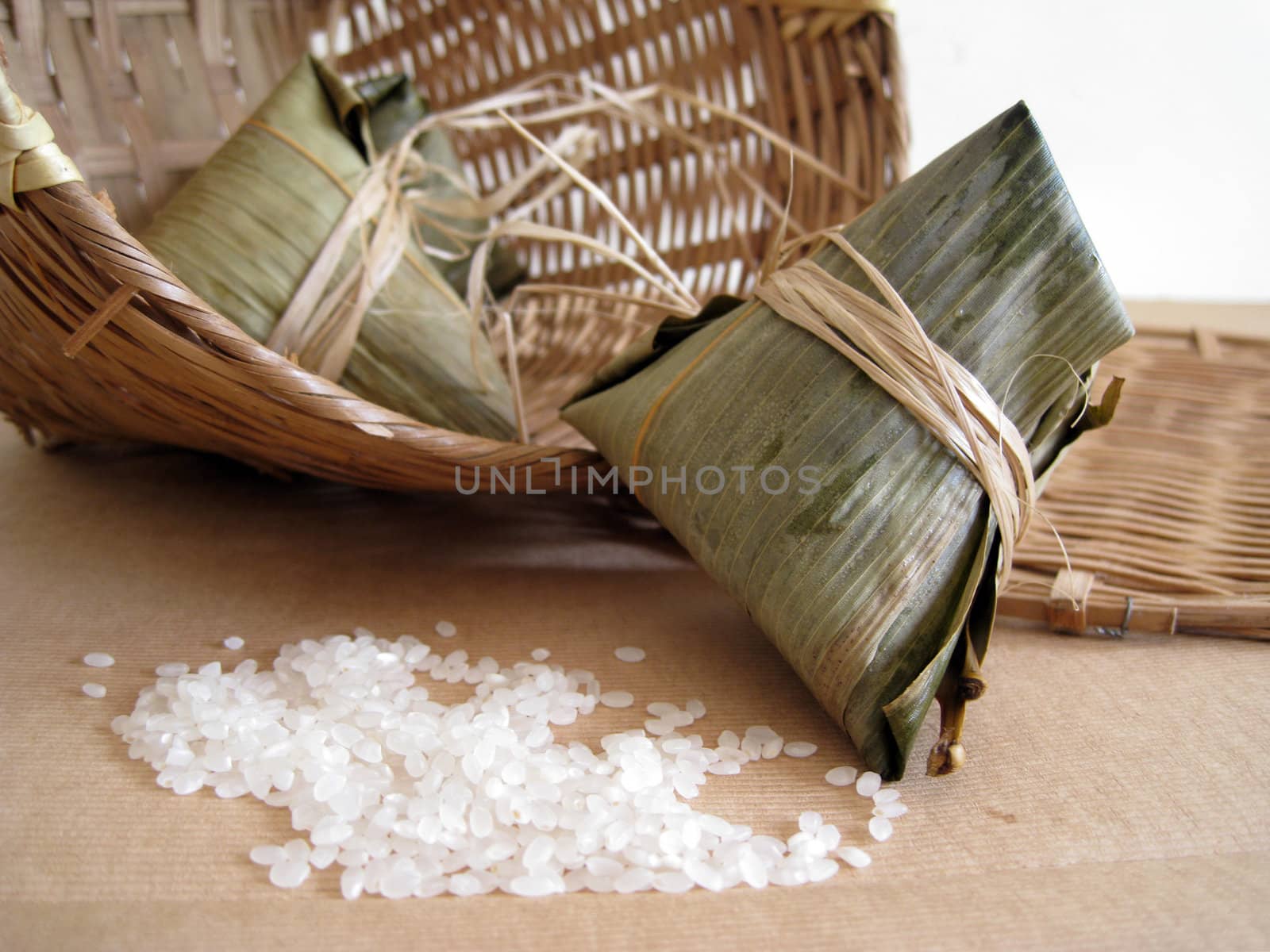 a pyramid-shaped mass of glutinous rice wrapped in leaves, one culture occasion in Chinese