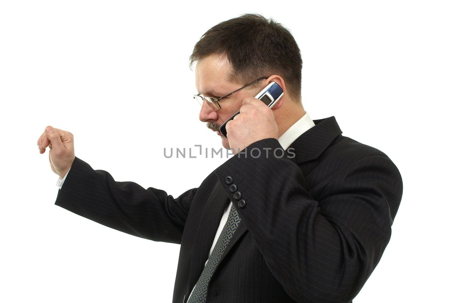  Businessman speaks by mobile phone isolated on white