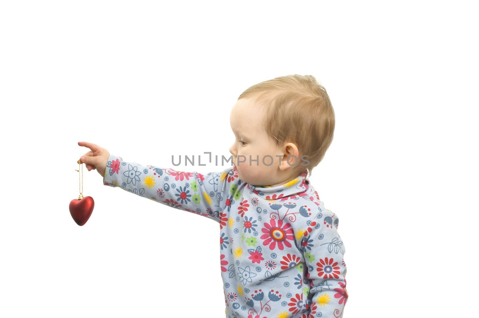 Baby girl with  red glass heart isolated on white background