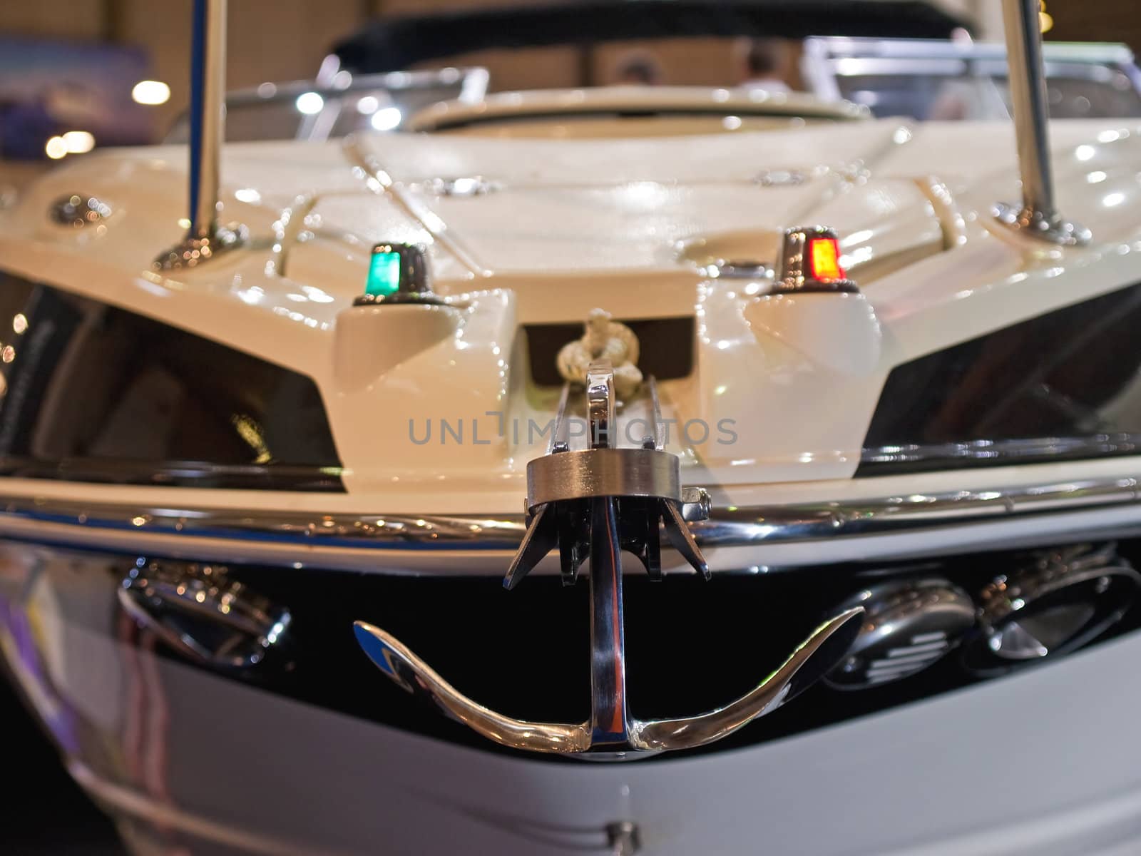 Front close view of a speedboat bow with an anchor