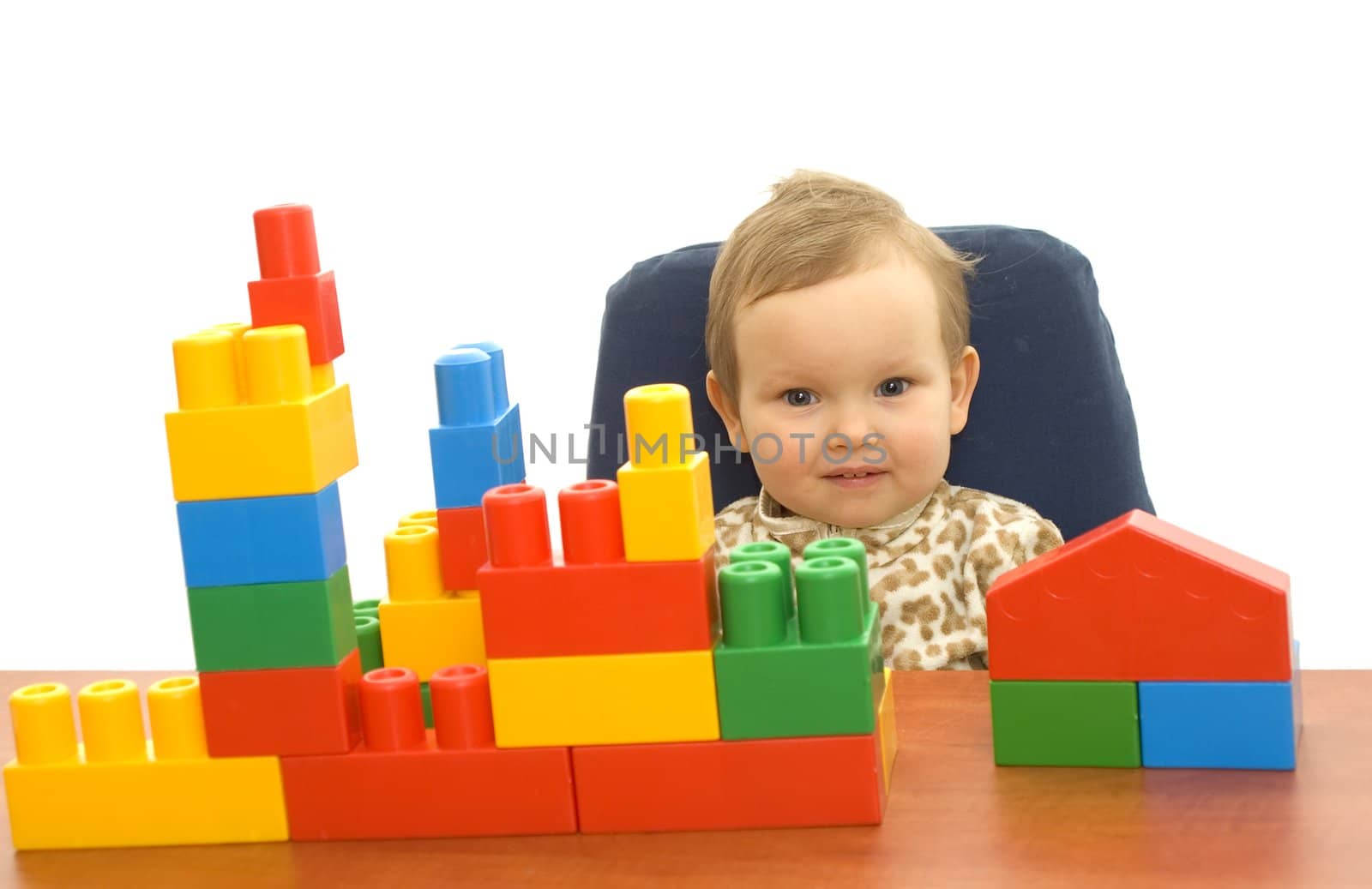 Cute baby girl with colorful blocks isolted background