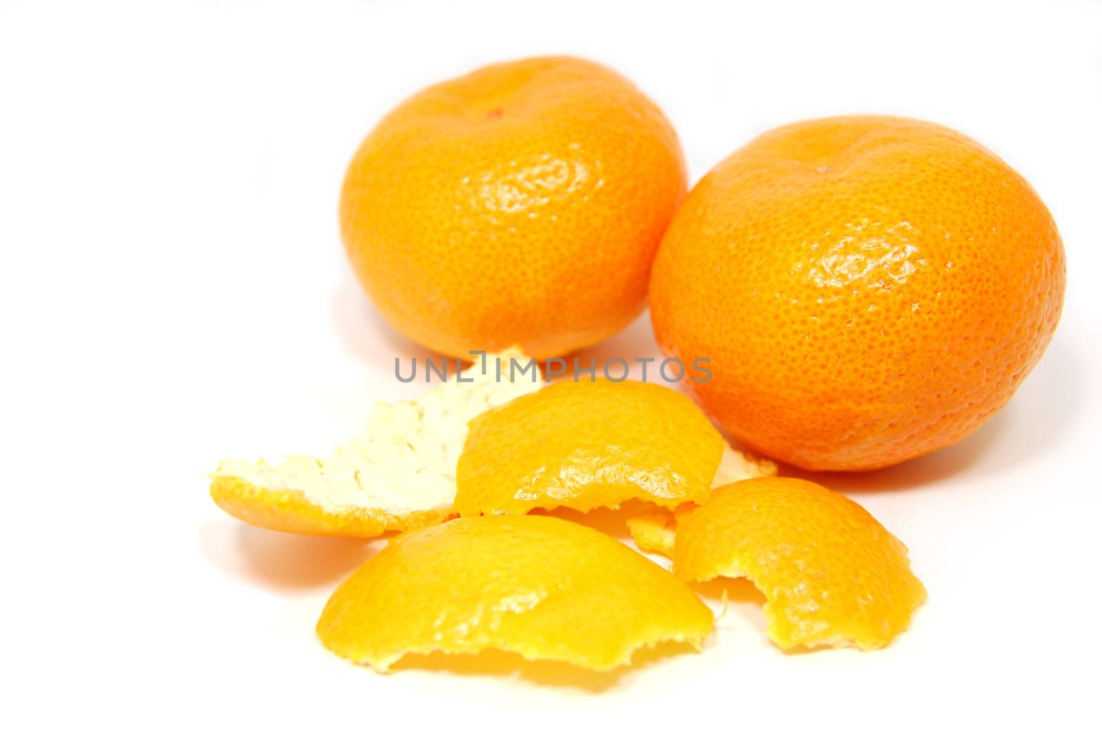 peeled tangerines isolated on white