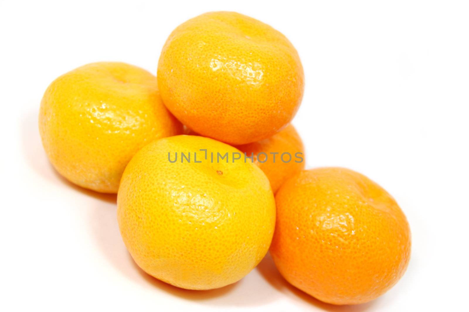 some tangerines isolated on white