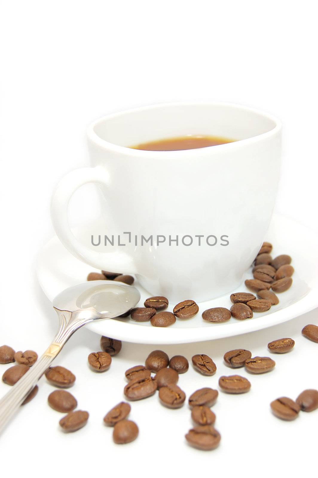 cup of coffee and coffee beads isolated on white