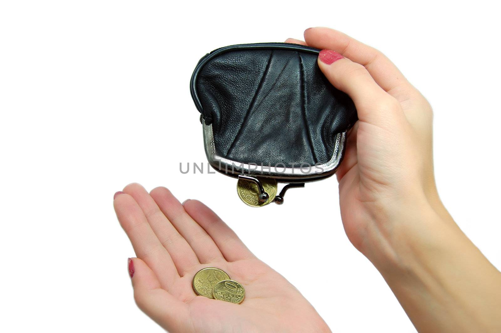 Female hands holding leather purse and some falling coins