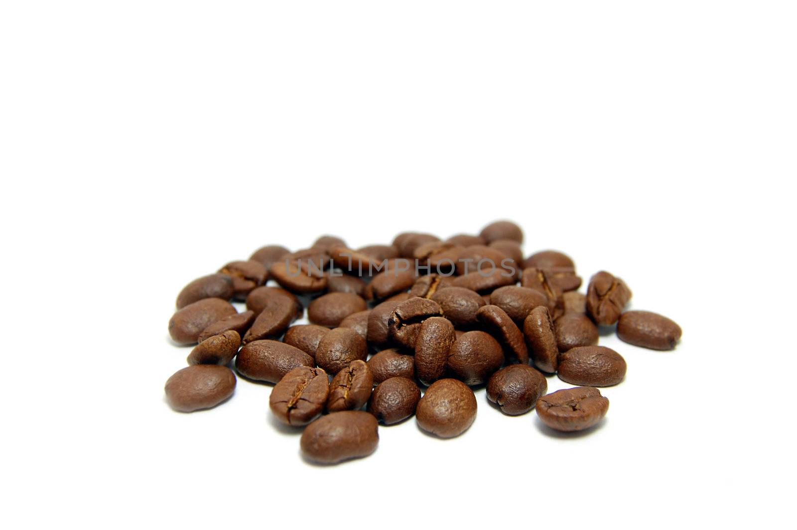 Heap of coffee beans isolated on white