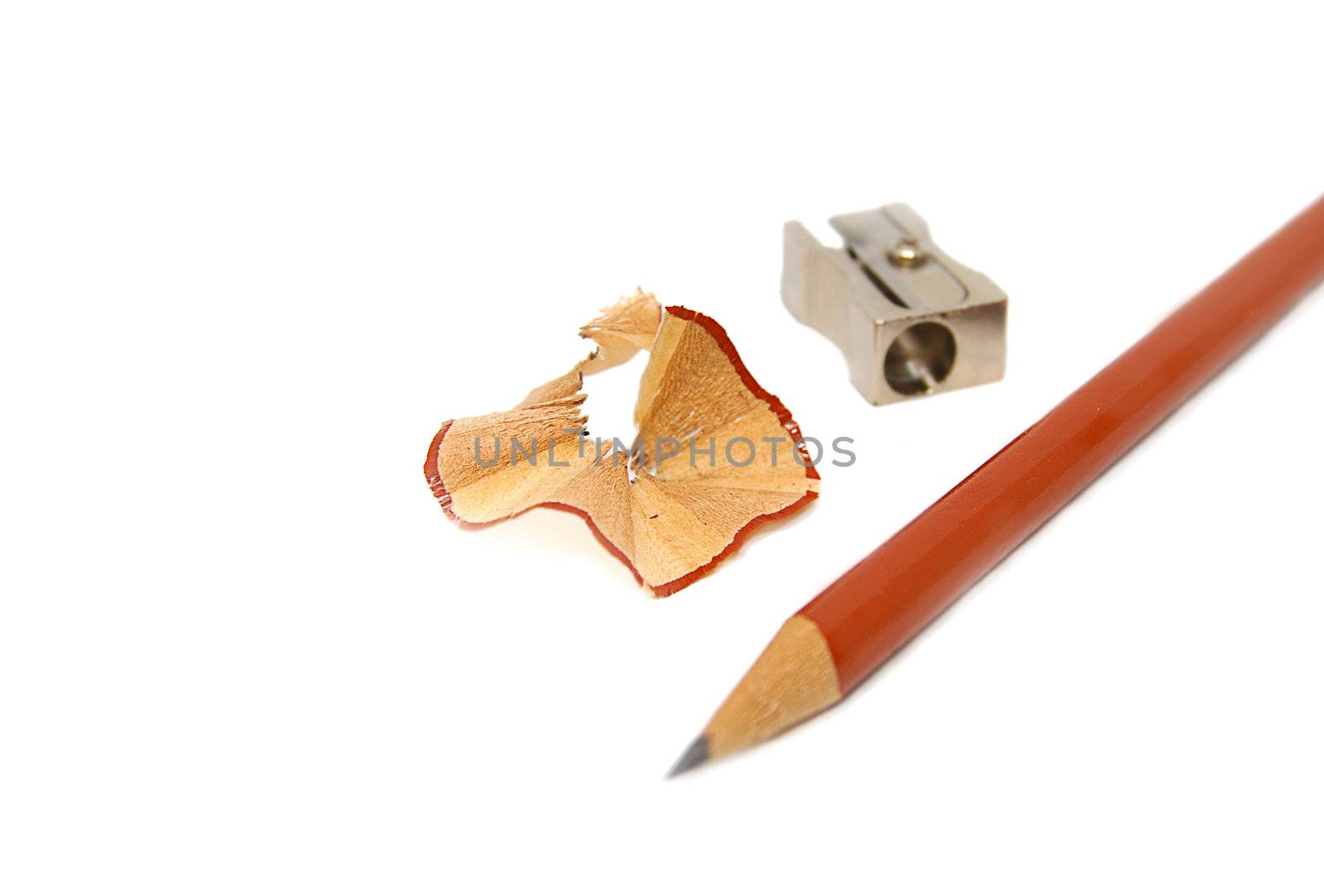 Sharpener, cuttings and pen isolated on white