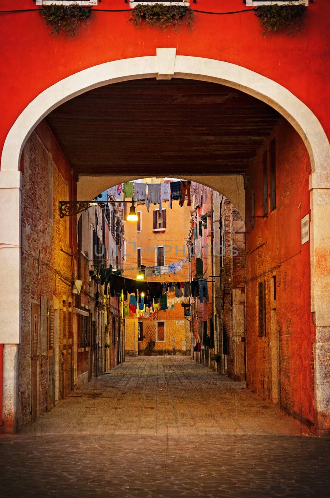 Old Venetian yard, Italy.Photo in old color image style.