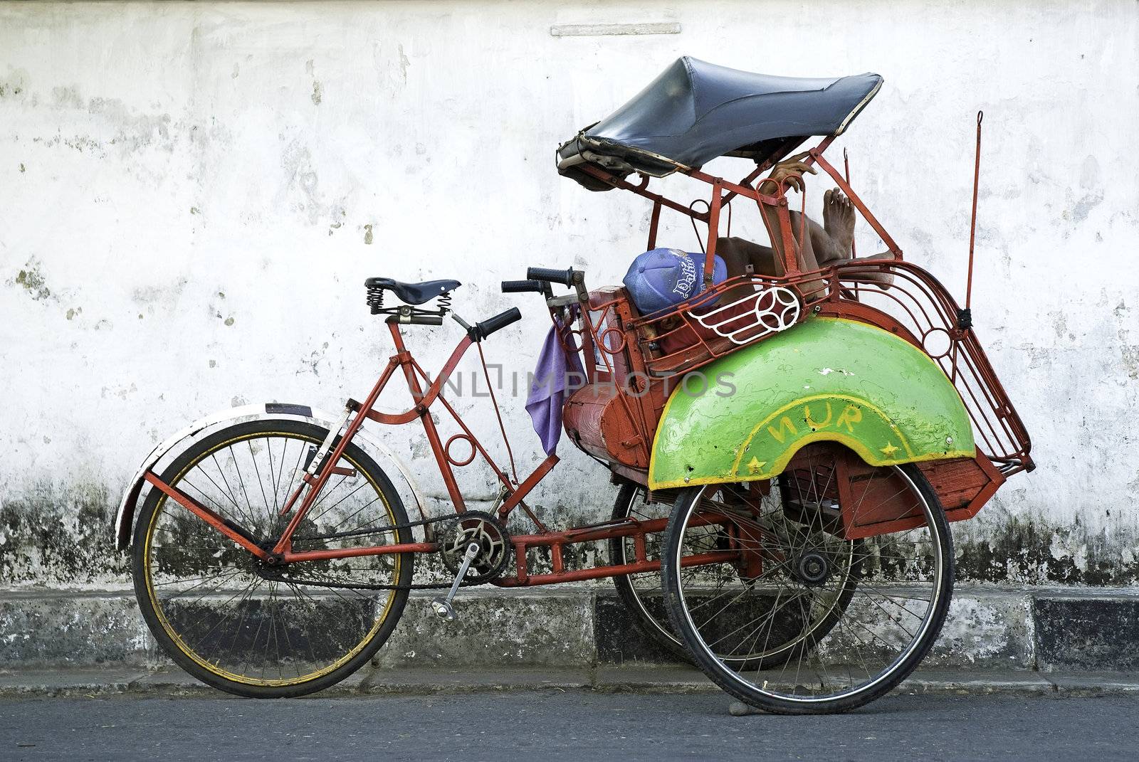 becak cyclo taxi in yogyakarta indonesia by jackmalipan