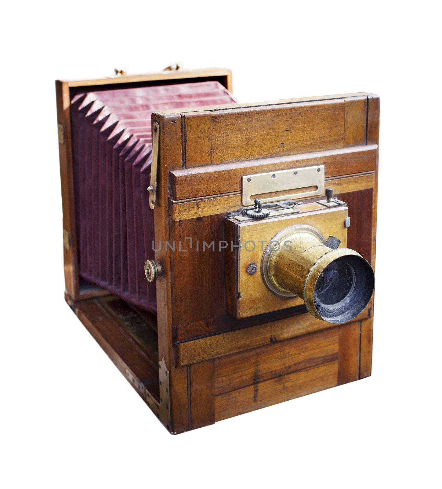 Antique 19th century wooden large format camera with bellows isolated on white.