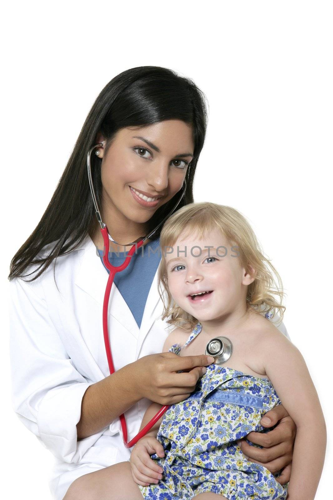 Brunette pediatric doctor with blond little girl on medical exam