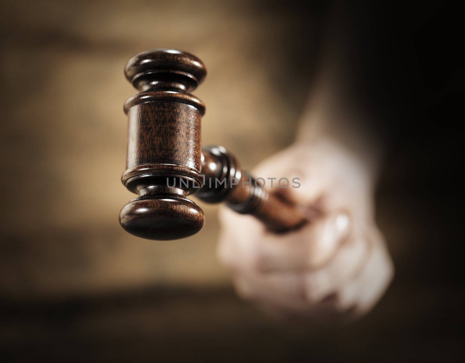 A high quality mahogany wooden gavel. Very short depth-of-field.