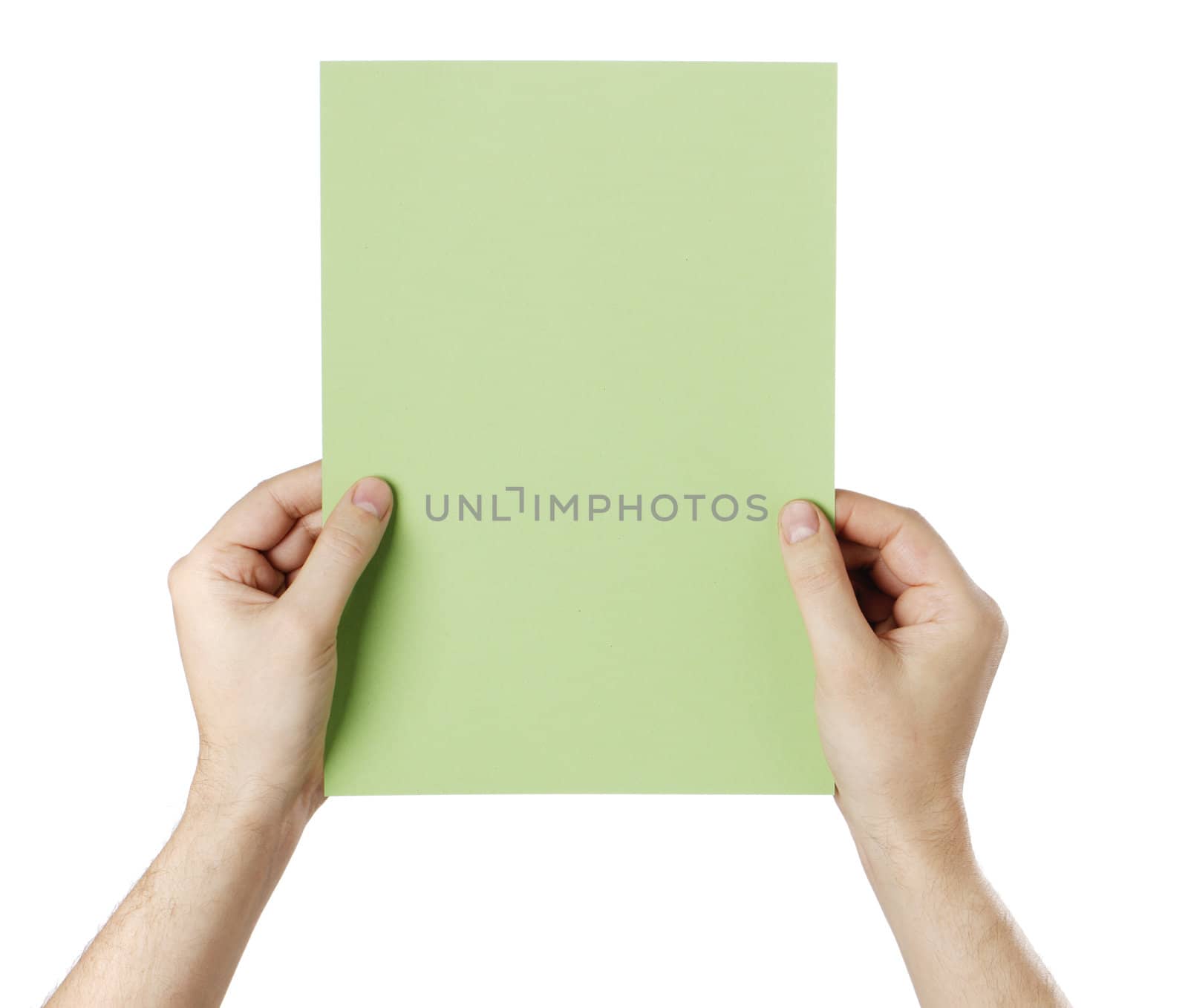 Man holding a blank light green paper against white background.