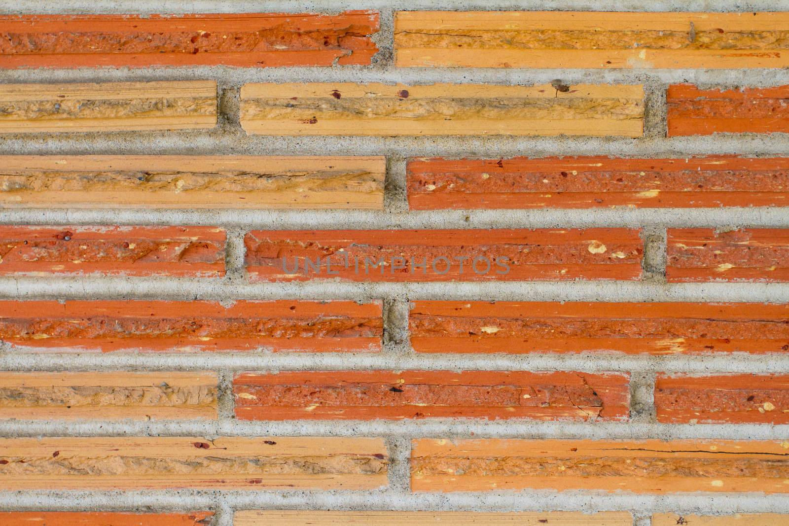 This texture image shows some thin bricks and mortar on the outside of a building.