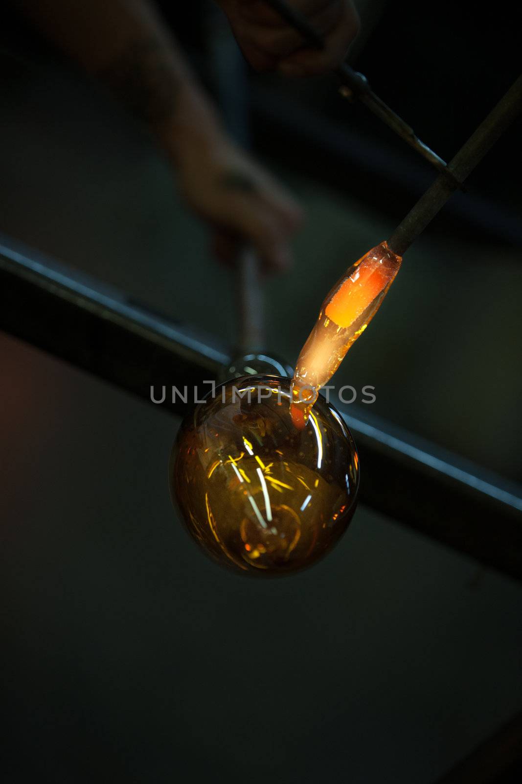 Close up of flame from blowtorch heating up glass art object