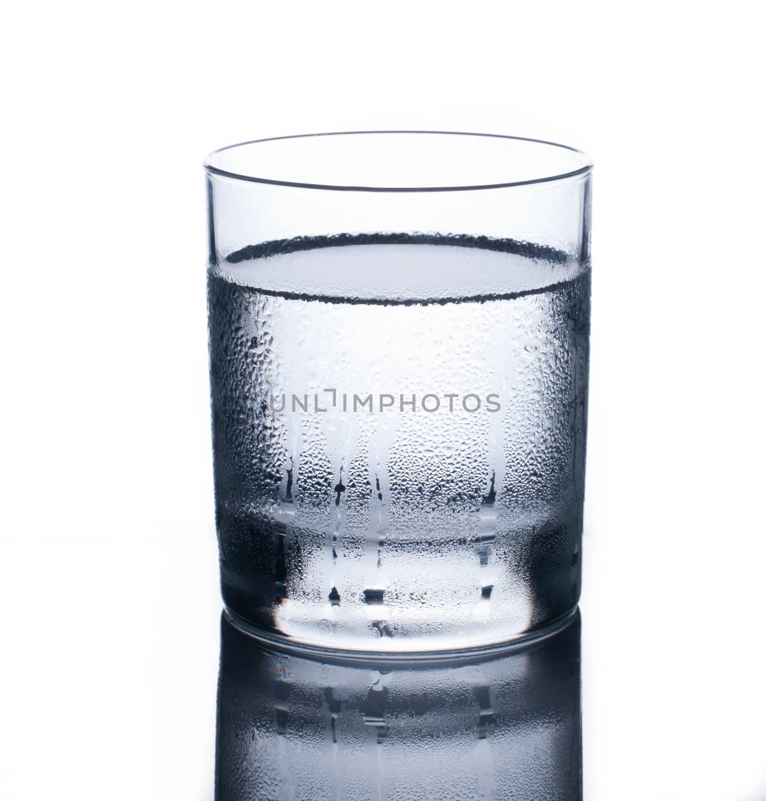 Glass of clear cold water isolated on white background