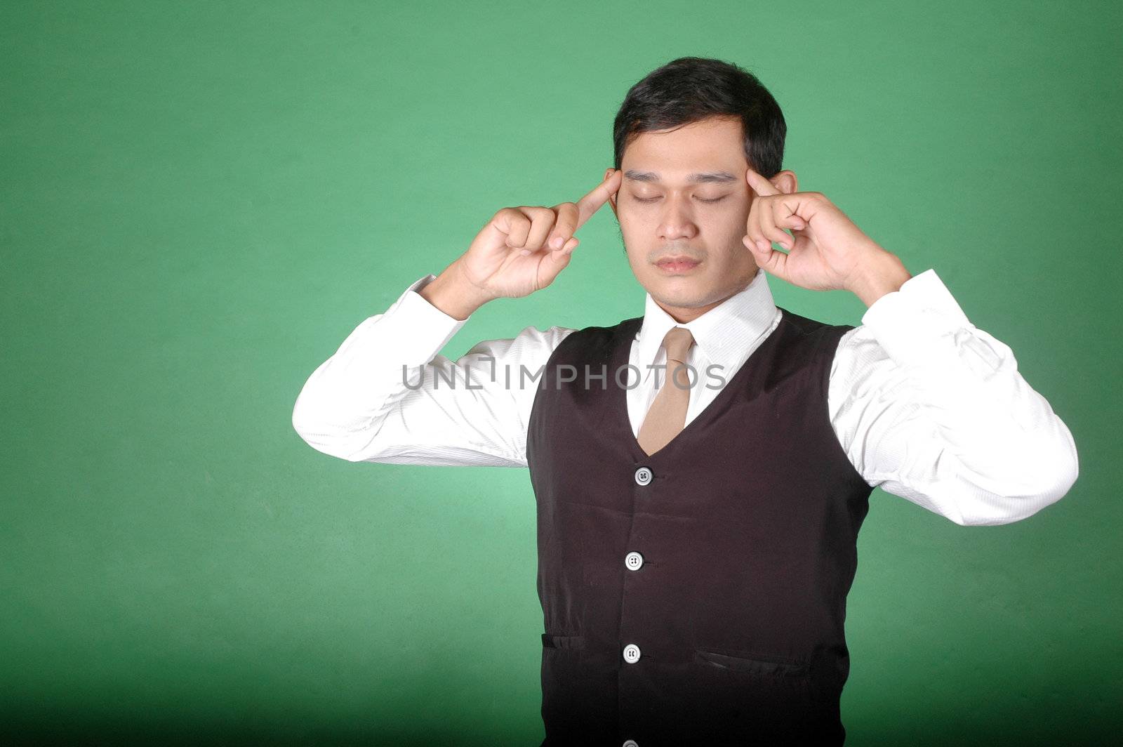 asian young man with posture was thinking against green background