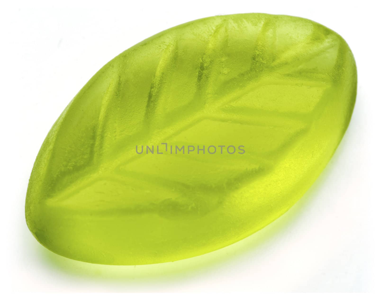 Leaf shaped jelly in green color on white background.