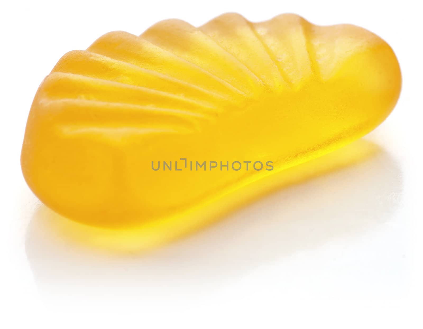 Mandarin shaped jelly in orange color on white background.