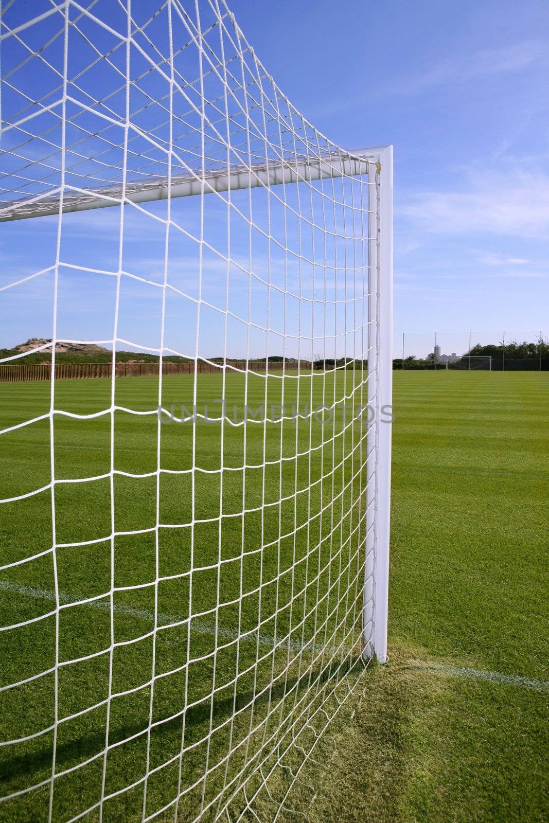 Net soccer goal football green grass field by lunamarina
