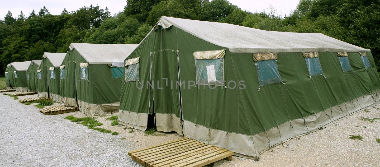 Green tent camp in Pyrenees for Santiago pilgrims by lunamarina